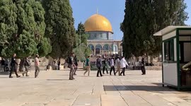 Israeli settlers walk through the courtyard of Jerusalem's Al-Aqsa mosque compound and the Old city, in Jerusalem