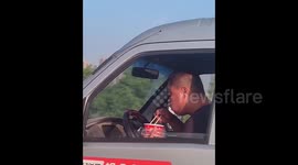 Funny moment truck driver is caught eating instant noodles behind wheel