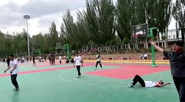 Remarkable long-range three-point shot leads to eruption of cheers during student game