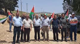 Palestinians argue with Israeli security forces during a protest
