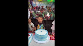 Birthday Boy Bites Own Cake