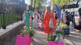 Visitors leave on the final day of the Chelsea Flower Show after famous plant sale
