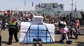 Someone comes dressed in Cosplay as the Excel Center which is where Cosplayers are for the MCM Comic Con