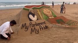 Sand Artist sculpture of New Parliament Building enthrals at Puri beach