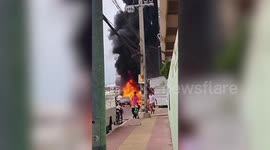 Pick-up truck carrying dozens of paint thinner bottles bursts into flames near homes in Thailand