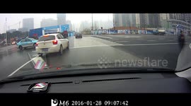Taxi hits car, sending it smashing into a lorry