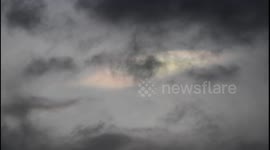 Rare colourful nacreous clouds filmed through 400mm lens