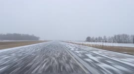 Snowy road conditions on Interstate-29 road in the US