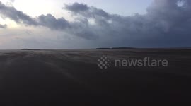 Storm Henry creates a stunning 'sand river' on UK beach