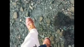 Walking on a frozen lake with crystal clear ice