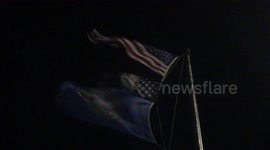 American Flag Blowing During Blizzard