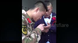 Firefighter helps groom take out wedding ring getting stuck on his finger