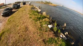 Fishermen Fight Pelicans For Fish