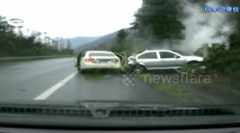 Car parking on emergency vehicle lane is crashed by a losing control car behind it