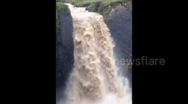 Heavy rain turns Devon waterfall into torrent