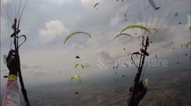 Paragliding in the middle of dozens of other pilots
