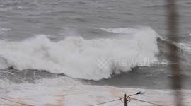 Australian surfer rides monster waves during storm