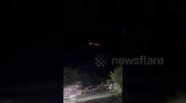 Burning space debris streaks over homes in the Philippines