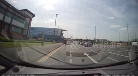 Driver predicts Electric scooter goes through red traffic light
