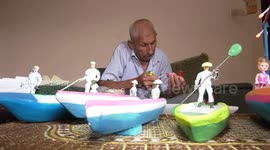 An elderly Palestinian Tawfiq Al-Jojo, 75, makes models of ships at his home in Shati refugee camp, west of Gaza City