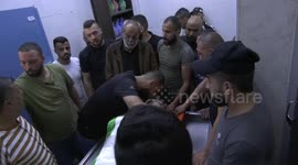 Mourners carry the body of Palestinian Ashraf Mohammed Ibrahim who was killed during an Israeli raid, during his funeral in Jenin in the West Bank