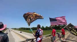 A group of “American Patriots” Trump Supporters wave flags to cars driving by on Memorial Day weekend