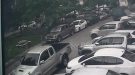 Buddhist monk ploughs into eight vehicles in carpark 'after fainting at the wheel' in Thailand