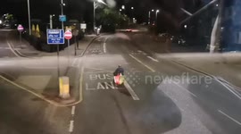 Man drives wheelchair on main London road prompting confrontation with bus driver