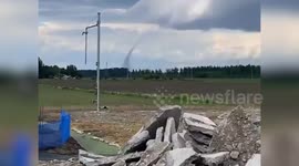 Terrifying dust devil tornado whirls across fields in Hokkaido, Japan