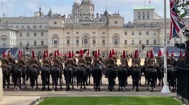 British cavalry regiment rehearse for Trooping the Colour ceremony