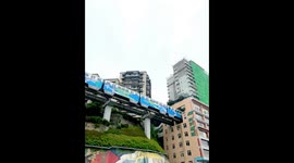 Trains astonishingly pass through 19-storey building in China's mountain city