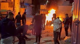 Israeli soldier clash with Palestinians following a raid by in the West Bank