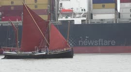 Sailing Barge Thalatta (built 1906, carrying capacity 67 tons) passes container ships MSC Lisbon and MSC Loreto at the Port of Felixstowe on Tuesday, 30 May, 2023.