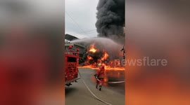 Firefighters battle inferno engulfing pick-up truck loaded with solvent bottles