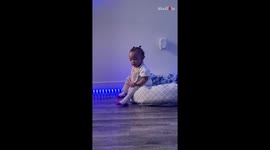 Toddler tries crossing her legs; learns that her transformation into a complete lady would take time