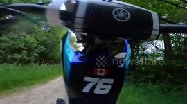 Biker attempts wheelie but fails and lands on their feet