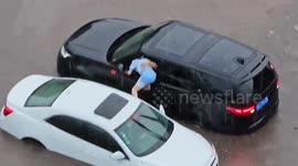 Chinese man drives SUV to save motorist trapped in floodwater