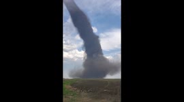 Storm chaser encounters HUGE tornado column ripped through fields in Canada