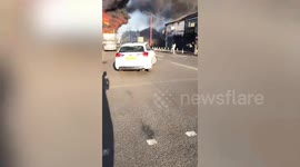 Dramatic moment double decker bus is engulfed in flames during arson attack on busy city road