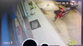 'Reckless' driver smashes into office building after car slips on wet road in Thailand