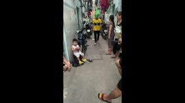 Unexpected overwhelm: child's tearful reaction to a playful encounter with a green frog mask!