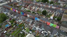 Artist transforming city by painting its houses different colours unveils her latest street of 63 'rainbow' homes