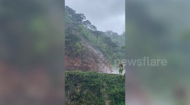 Heavy rain triggers landslide along mountain road in the Philippines
