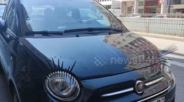 Car eyelashes. Fiat 500. Paris suburb, France, Saint-Quentin-En-Yvelines, Montigny-le-Bretonneux. 1 june 2023.