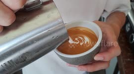 Satisfying moment coffee artists create beautiful drinks  in Malaysia