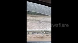 Japan's streets are covered in thick mud as country is badly hit by Tropical Storm Mawar