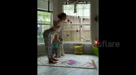 AFTER using yoga to beat postpartum depression, this mother has now mastered holding difficult yoga positions at the same time as breastfeeding her two-year-old daughter who walks up to her mum and latches on at any point.