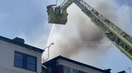 Firefighters battle to extinguish blaze burning through house in Finsbury Park
