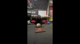 45 year old woman in London doing Strongman Competition Training with the Atlas Stone