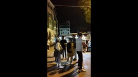People enjoy the evening around the Galata Tower in Istanbul, Turkey